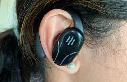 Talky AI Buds worn in-ear during a hands-on review session