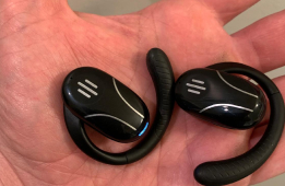 Close-up of the Talky AI Buds charging case used in a product review